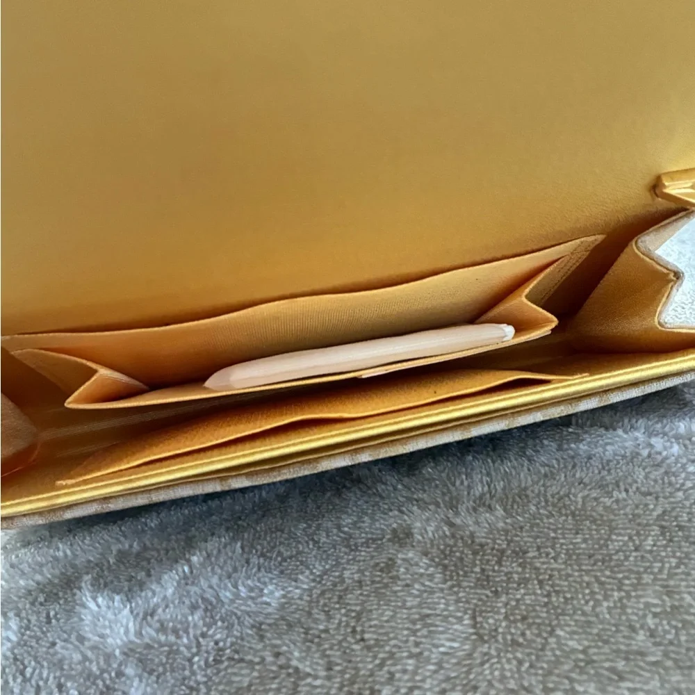 Mikimoto Cream Clutch with Gold Accents